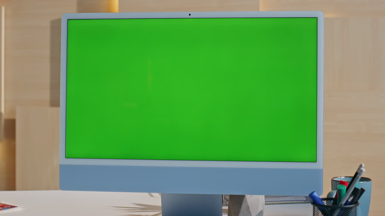 Chroma key desktop computer standing on contemporary office desk close up.