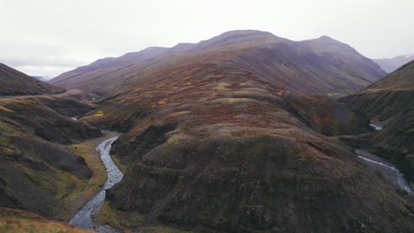 Aerial-view-to-reveal-Iceland-fjord-on-a-foggy-day-near-the-Ring-Road-which-is-a-scenic-highway-through-a-picturesque-remote-fjord-area