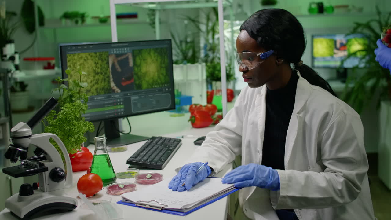 Scientists researchers working in biotechnology lab looking at vegan food