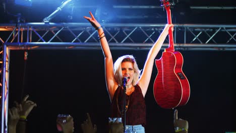 singer performing on stage