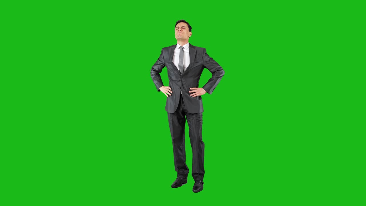 Man in Suit on Green Screen Displaying Various Expressions