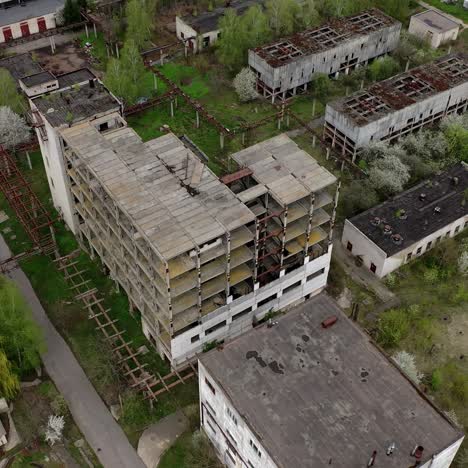 ruined factory buildings. abandoned warehouses or production department on the factory territory. old industrial edifices for demolition. aerial view