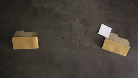 brown envelopes and paper on dark surface