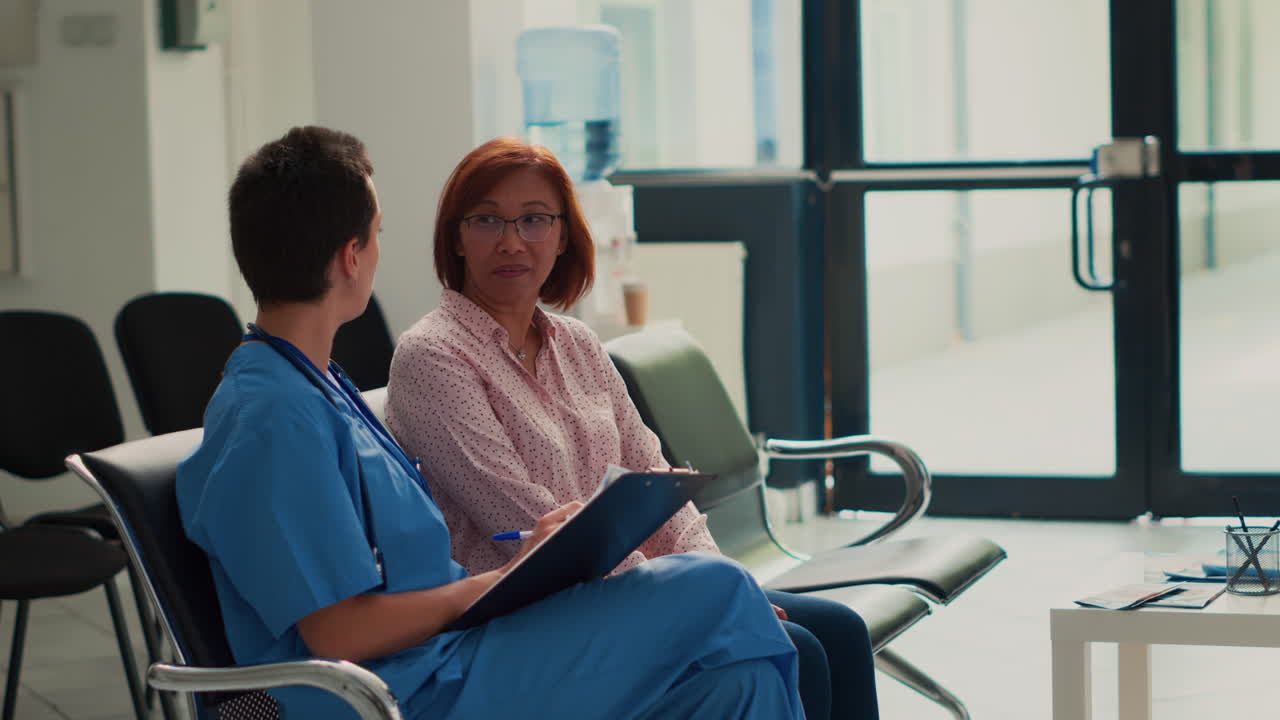 Nurse consulting with patient in waiting room