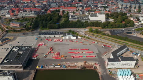 Look-up-aerial-of-power-station-revealing-the-skyline-of-the-city-of-Esbjerg,-Denmark.-The-city-is-one-of-the-most-important-seaport-in-Scandinavia