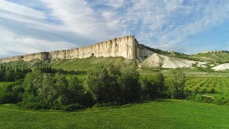 white cliffs and lush valley landscape