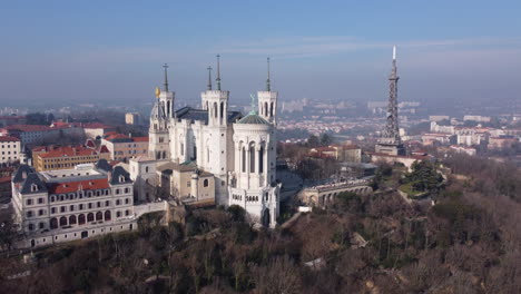 aerial view of notre dame de fourviere basilica on hilltop of lyon french city at day time