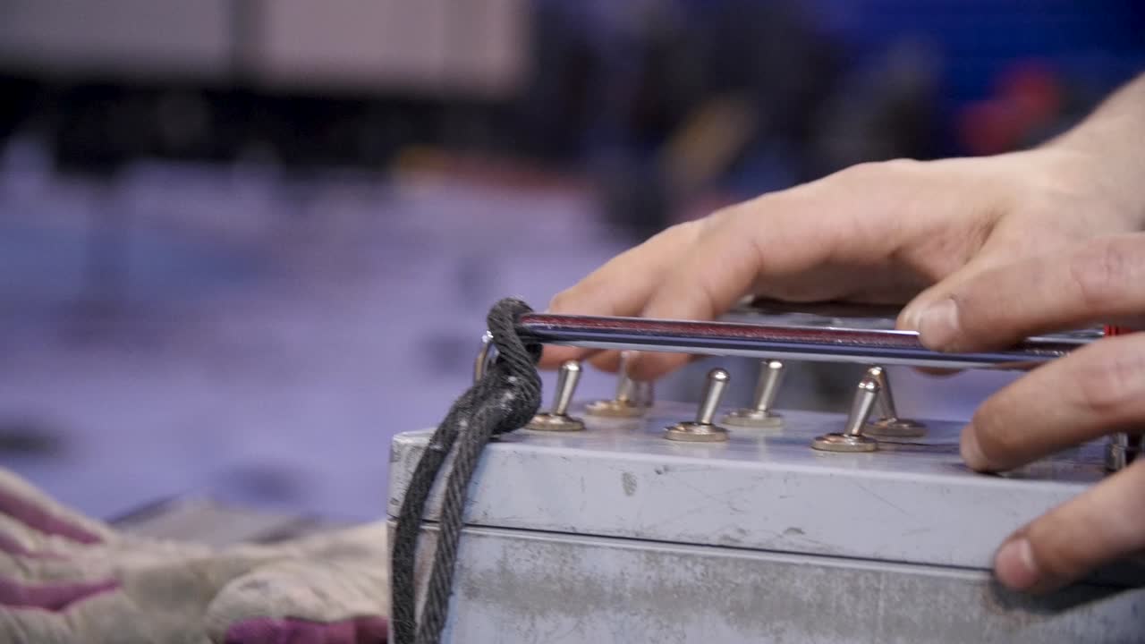 Person Operating Industrial Control Panel