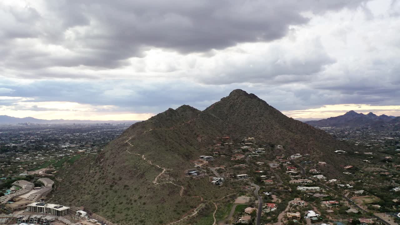 Drone shot of mountains surrounded by homes in Phoenix, Arizona