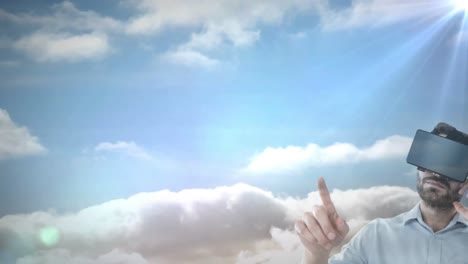 Animation-of-man-wearing-vr-headset-against-sky-with-clouds