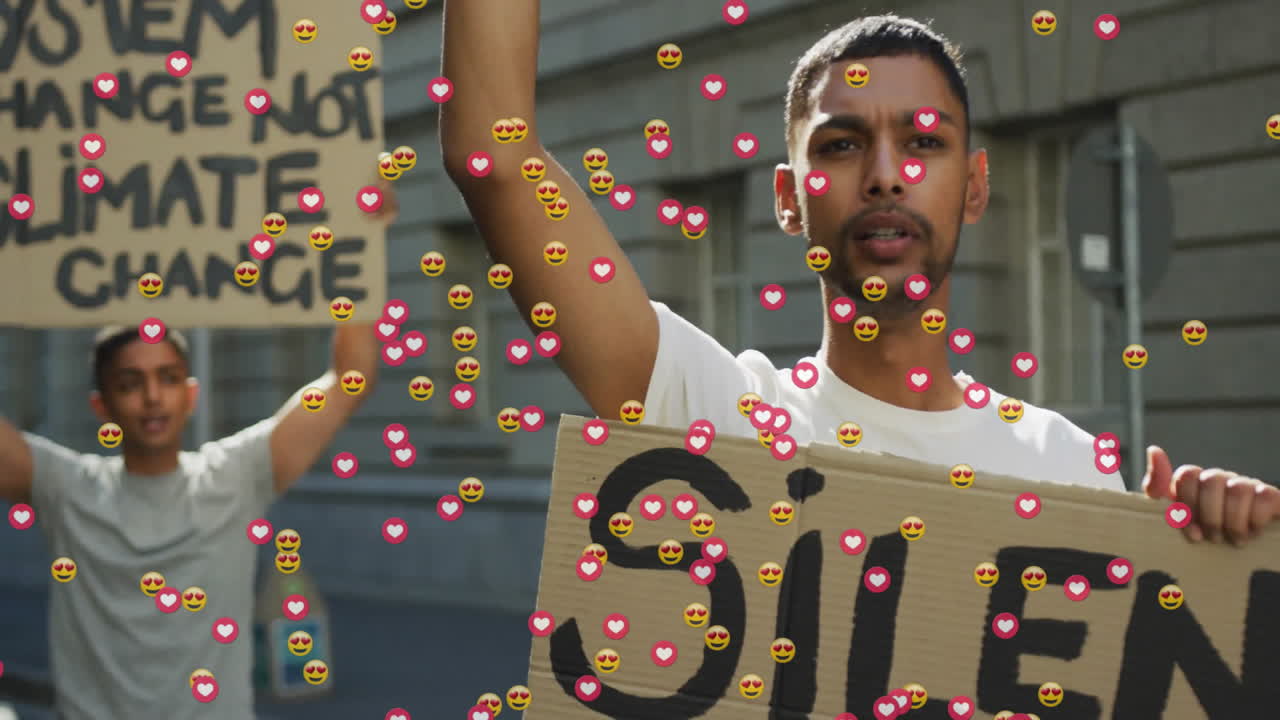 Two male protesters holding signs outdoors, showcasing climate activism with floating heart emojis