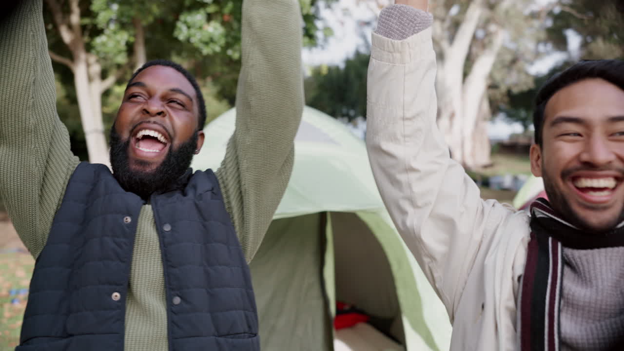 People camping in woods, hands together