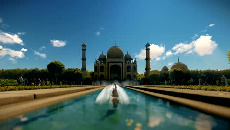 taj mahal with tourists against blue sky, tilt 4k