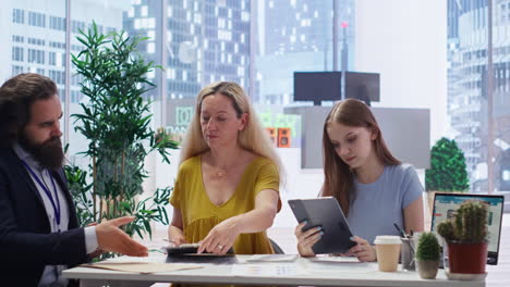 family receiving financial plan from financial advisor using laptop