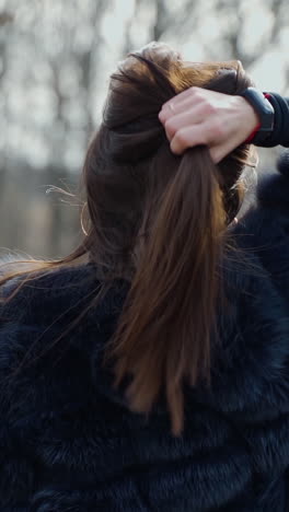 woman in fur coat outdoors