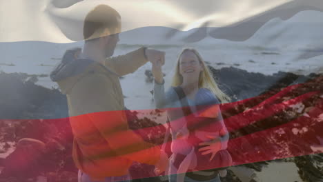 family enjoying beach walk with baby overlaid by waving russian flag animation