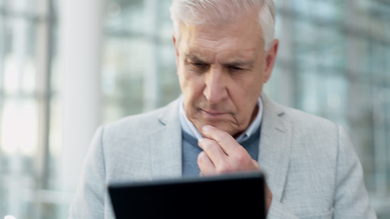 Tablet, thinking and senior business man in office