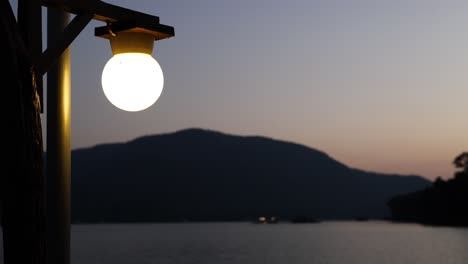 time-lapse of a lake view transitioning from sunset to twilight.