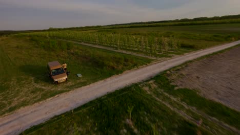 Aerial-shot-of-beautiful-landscape-and-hiking-trails-of-Kazimierz-field-with-green-grasslands-in-Poland