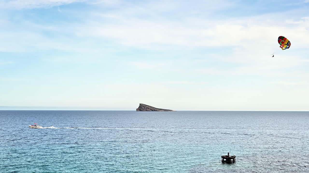 People parasailing in Benidorm, Alicante, Spain on a sunny day