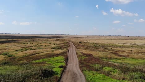 gravel road with water drainage cut aways for the heavy rainy season ahead