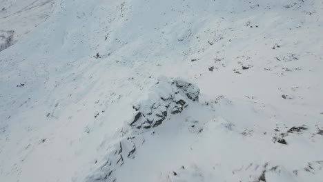 diving down the vertical face of djeveltanna in northern norway