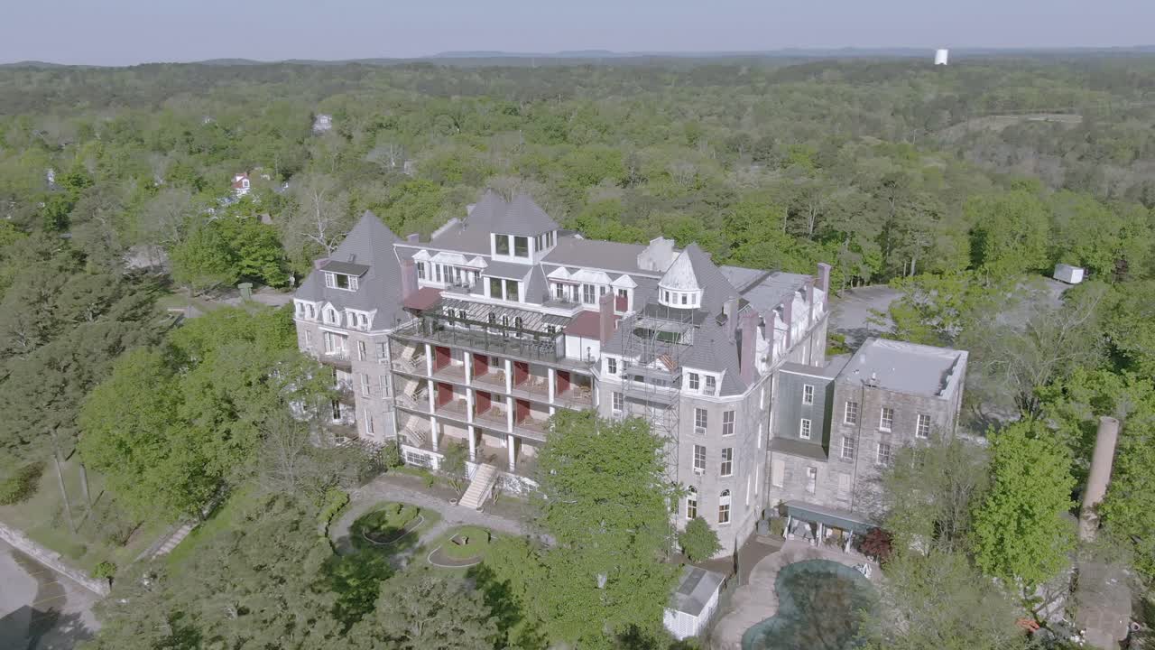 Aerial View of a Grand Historic Hotel Surrounded by Forest