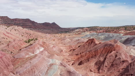 drone flies through colorful rock formation near tuba city, az