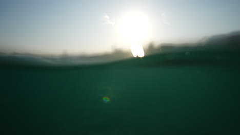 underwater view with sunlight reflecting on the surface and serene aquatic environment