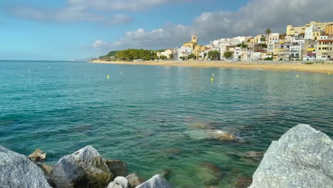 Platja-de-les-Barques-sea-field-Maresme-Barcelona-Mediterranean-coast-plane-close-to-turquoise-blue-transparent-water-beach-without-people