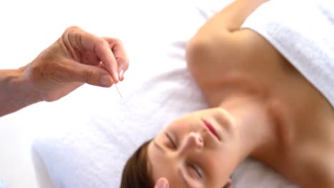 acupuncturist being nearly a needle