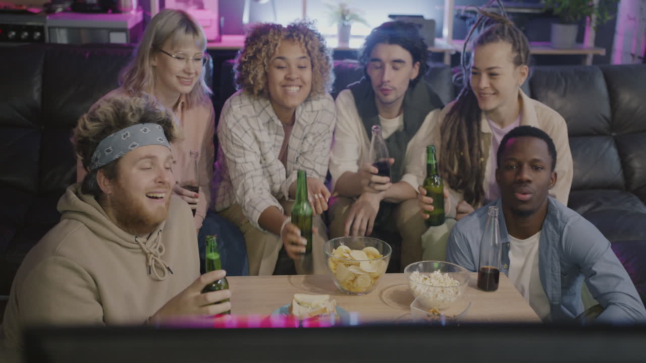 Friends Watching TV and Celebrating