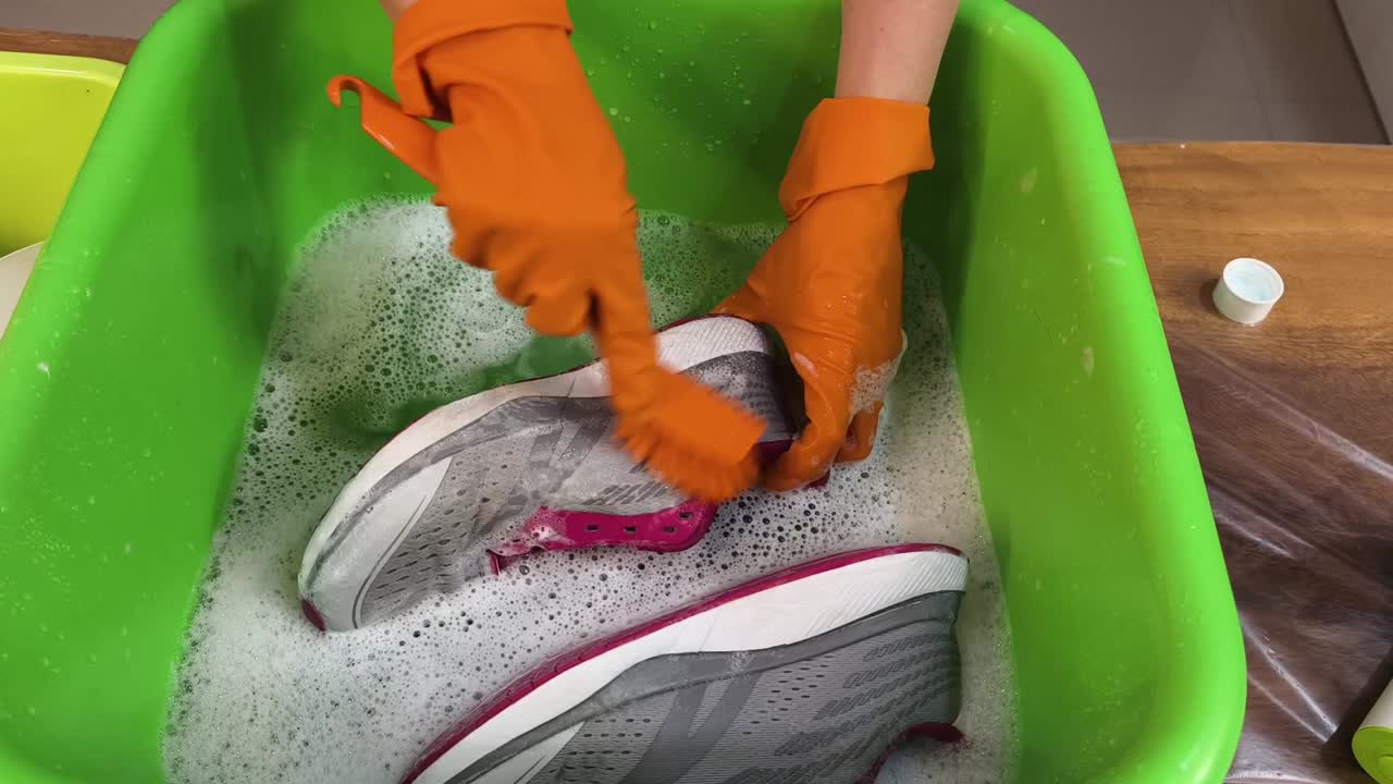 Washing and Cleaning Sneakers with Rubber Gloves