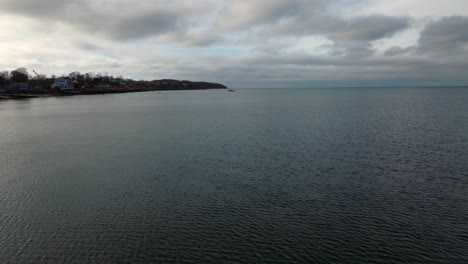 an aerial view over the calm waters of the long island sound on long island, new york