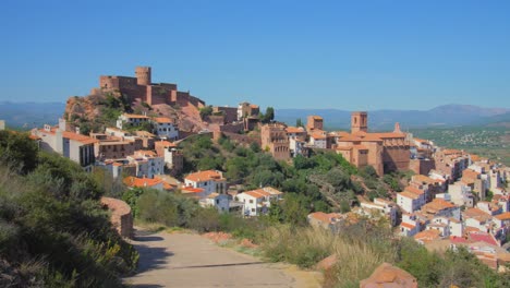 panning across beautiful colorful historic cityscape of vilafames in castellon, spain on sunny summer day