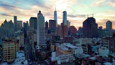 NYC-Soho-Sunset-Aerial-Rising-Over-Setting-Sun,-Aerial-Panorama-NYC-Financial-District