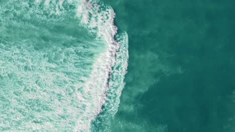 drone view of the ocean with waves crashing