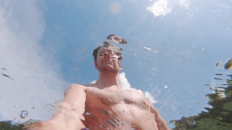 Young-White-Man-Psychedelic-Selfie-from-Underwater-in-Summer-Sun,-Low