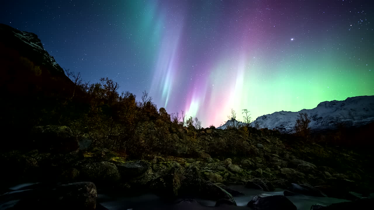 Aurora Borealis over Mountains and River