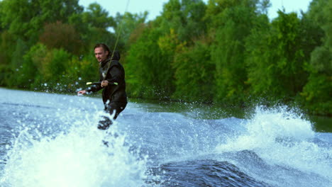 man riding board on waves