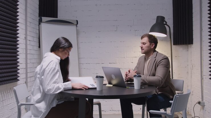 Man And Woman Having A Business Meeting In Boardroom 1