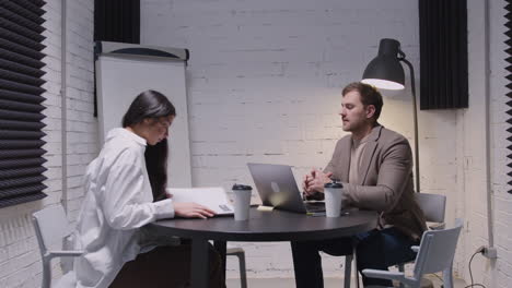 man and woman having a business meeting in boardroom 1