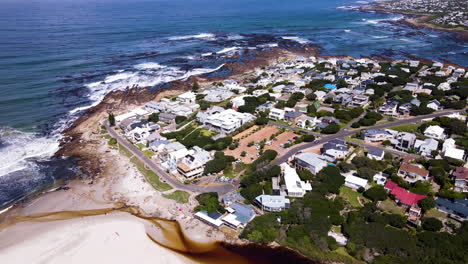 aerial tilt-down over scenic coastal town onrus with tannin-rich lagoon