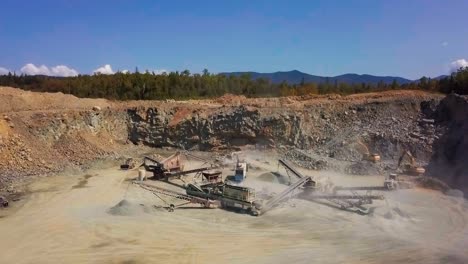 grand overview of rock crushing construction site in rock pit gravel quarry (hd 30p)