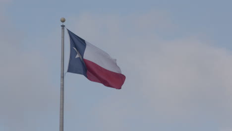 texas flag waving in the wind in austin, texas