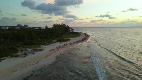 Picturesque-Playa-del-Carmen,-Mexico-Beach-Coastline-at-Sunset---Establishing-Aerial-Drone-View