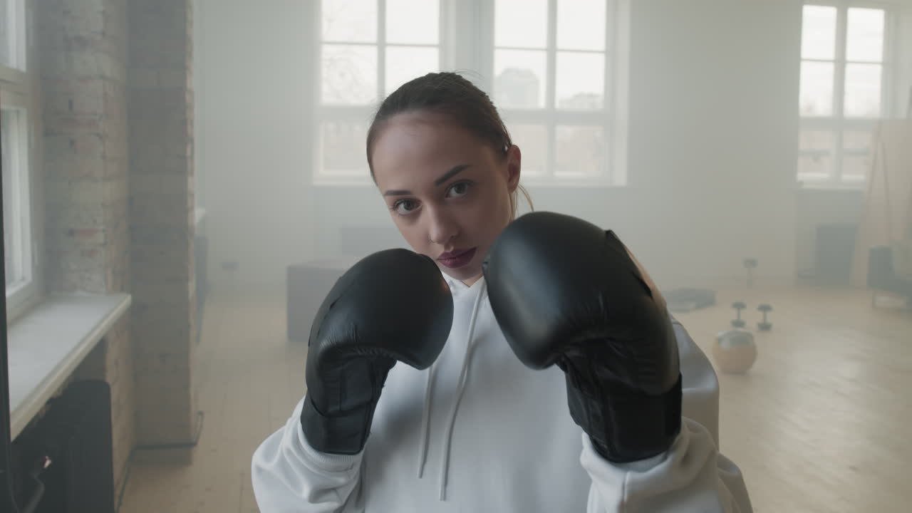 Portrait Of Female Boxer In Combat Stance