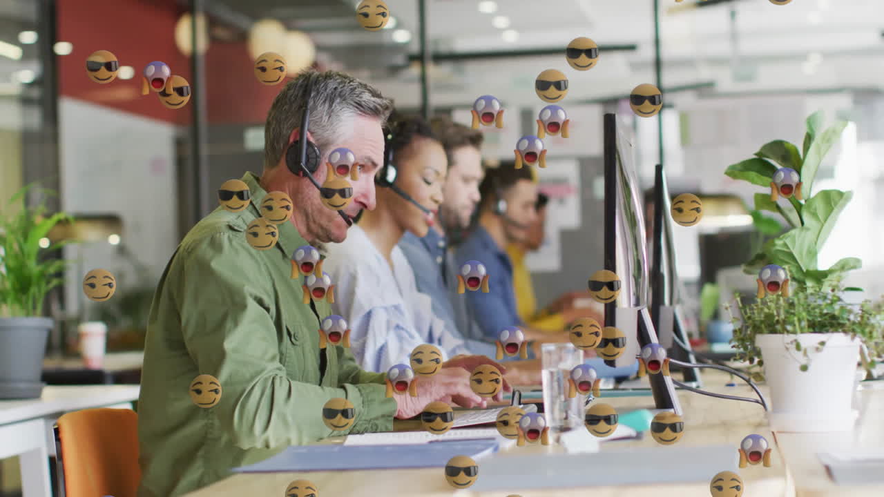 Five call center agents typing and speaking, wearing headsets and showing floating emoji overlays