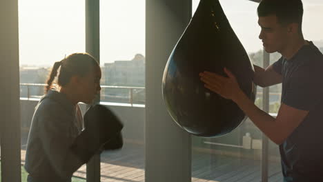 training, gym and woman boxing with a coach