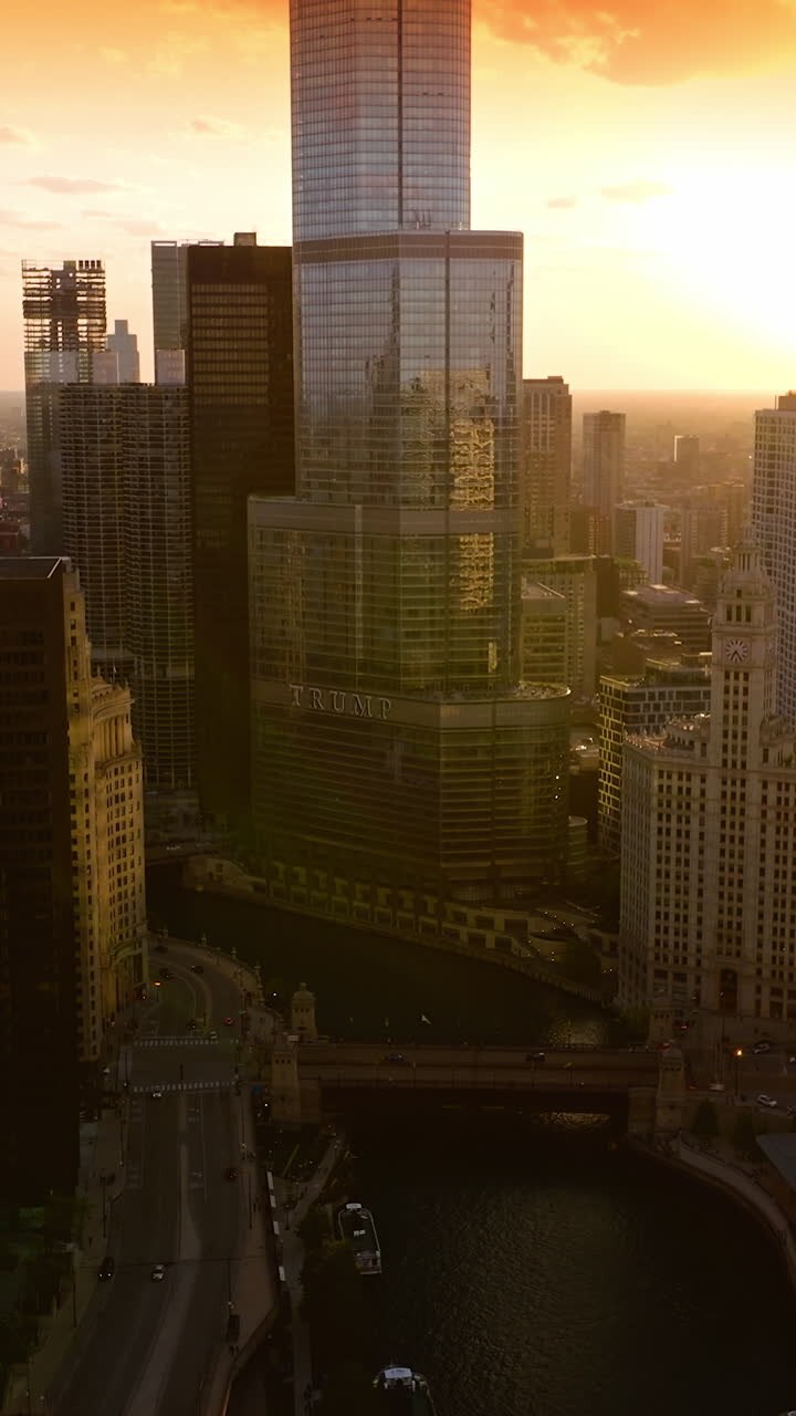 Sun dusk in Chicago, Illinois, United States. Drone footage over Chicago River at sundown. Vertical video